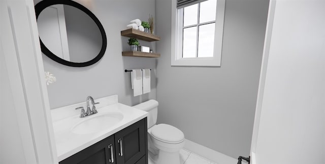 bathroom featuring tile patterned floors, vanity, and toilet