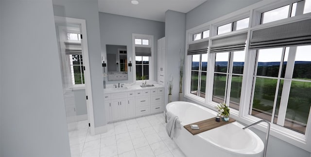 bathroom featuring tile patterned flooring, vanity, a healthy amount of sunlight, and a tub