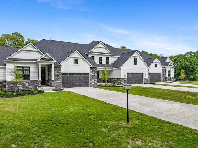 view of front of home with a front lawn and a garage