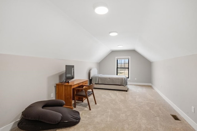 carpeted bedroom featuring vaulted ceiling