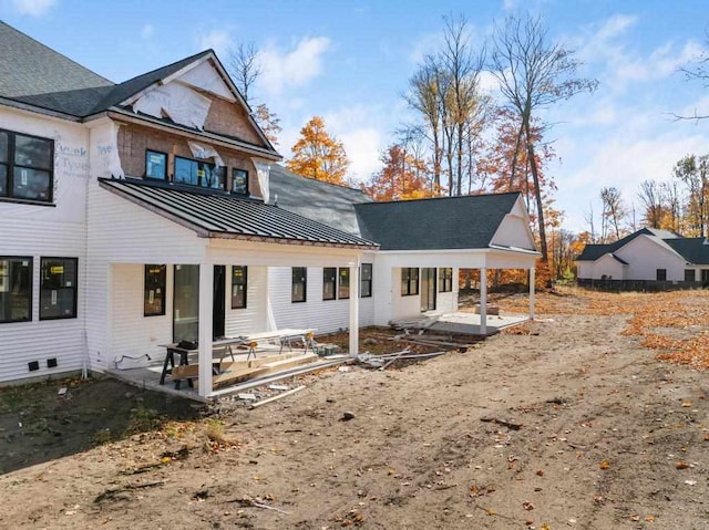 rear view of house featuring a patio