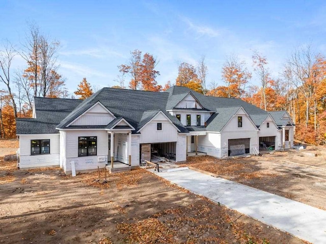 modern farmhouse featuring a garage