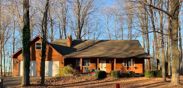 view of front of house featuring covered porch and a garage