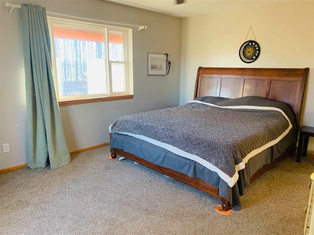 bedroom featuring light colored carpet