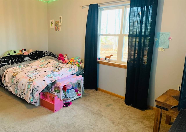 bedroom featuring light colored carpet