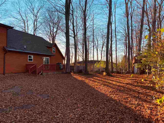 view of yard featuring a wooden deck