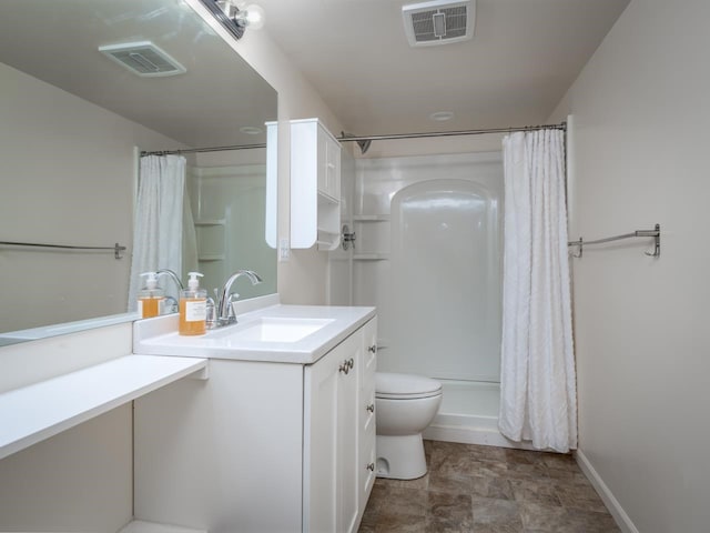 bathroom with vanity, a shower with shower curtain, and toilet