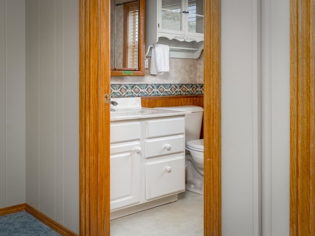 bathroom featuring vanity and toilet