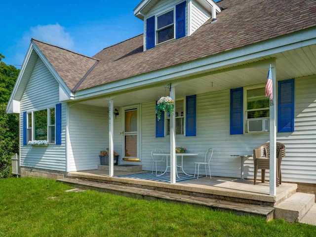 exterior space featuring cooling unit and covered porch