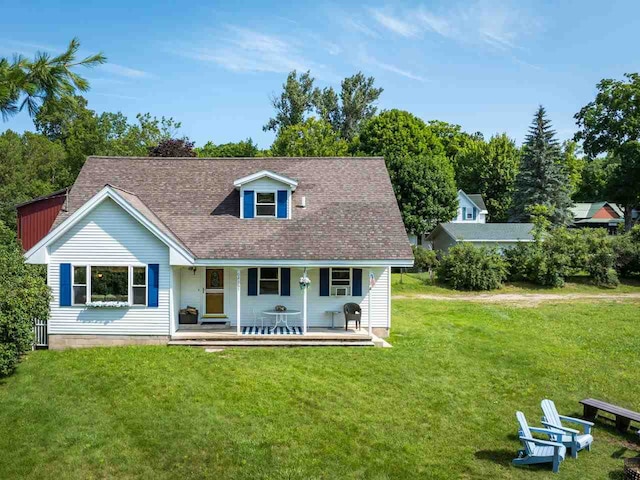 view of front of property with a front yard and a porch