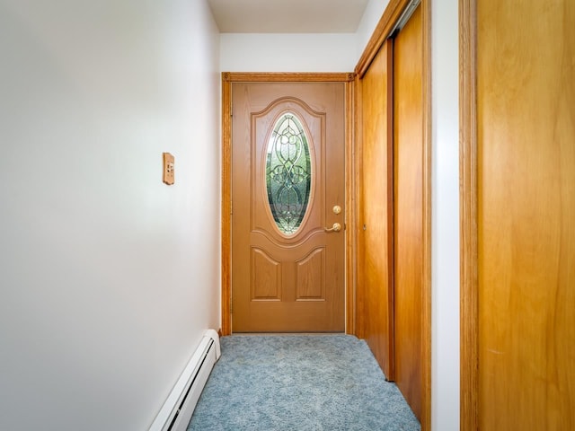 doorway to outside featuring carpet flooring