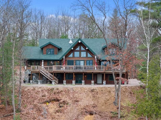 back of house featuring a wooden deck