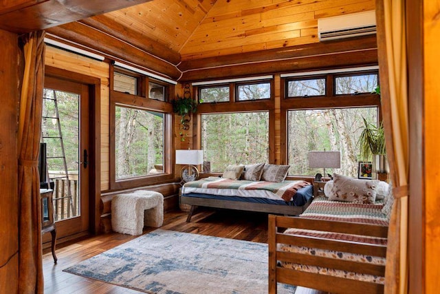 sunroom / solarium featuring an AC wall unit, wood ceiling, and vaulted ceiling