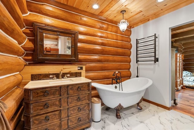 bathroom with wood ceiling, rustic walls, vanity, and a bath