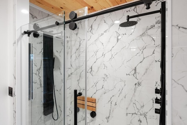 bathroom with a shower with shower door
