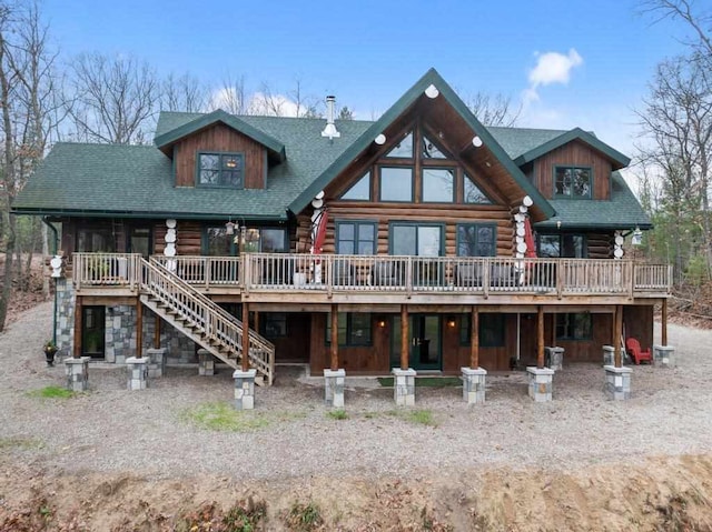 back of property with a wooden deck