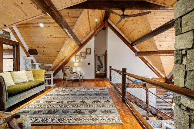 interior space featuring lofted ceiling with beams, hardwood / wood-style flooring, ceiling fan, and wooden ceiling