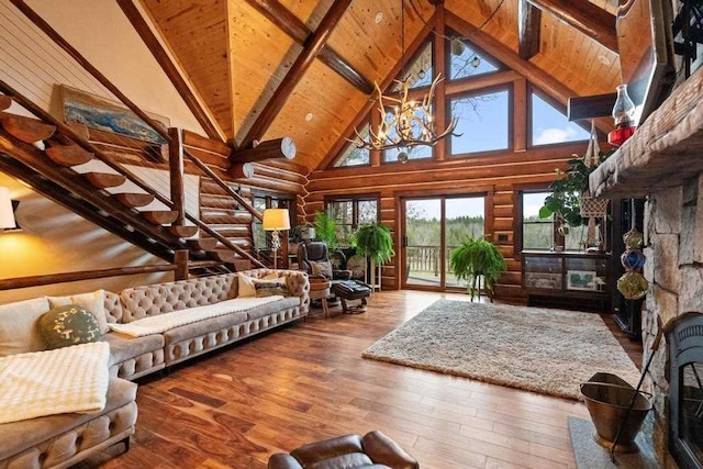 living room featuring a chandelier, wood-type flooring, high vaulted ceiling, and beam ceiling