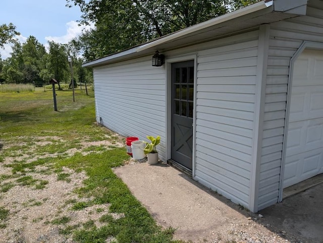 view of outbuilding with a lawn