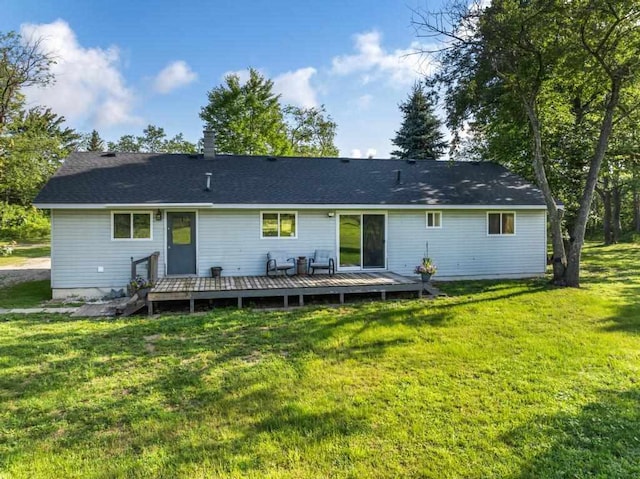 back of house with a yard and a wooden deck