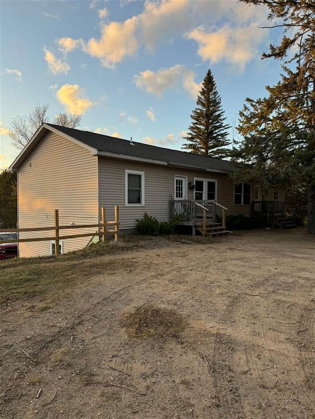 back of house with a wooden deck