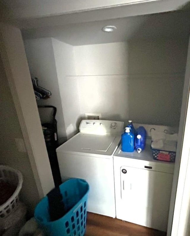 clothes washing area with washing machine and clothes dryer