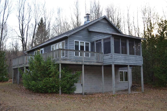 rear view of house with a sunroom