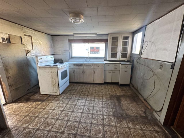 kitchen featuring white range with electric cooktop and sink