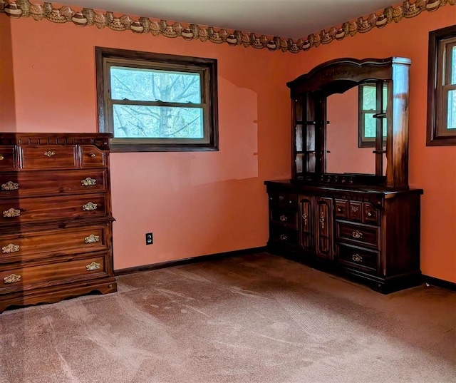 unfurnished bedroom with carpet flooring