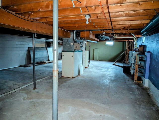 basement with heating unit and gas water heater