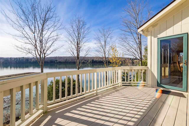 wooden deck with a water view