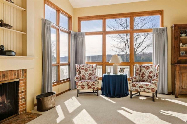 sitting room featuring carpet floors and a fireplace