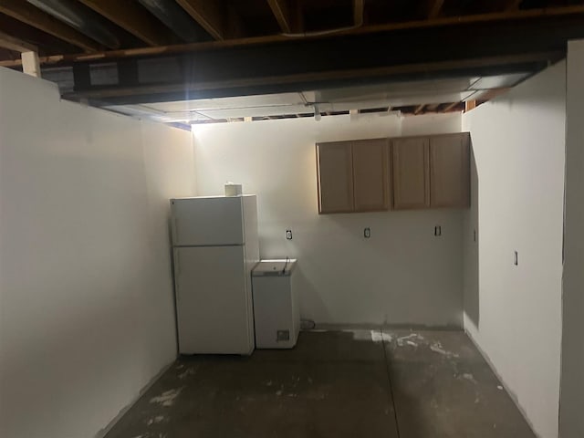 basement featuring white refrigerator