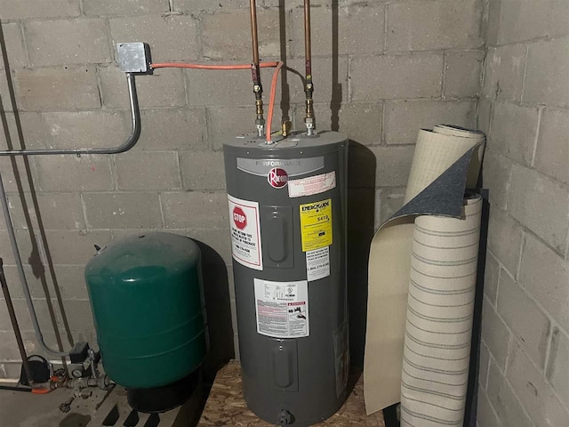 utility room featuring water heater