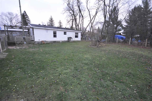 view of yard with a wooden deck