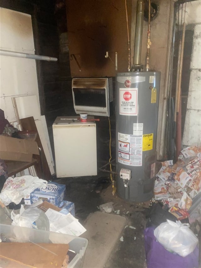 utility room featuring gas water heater