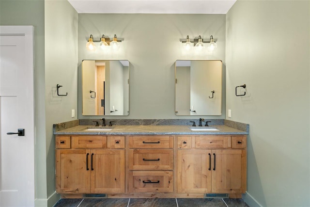 bathroom featuring tile patterned flooring and vanity