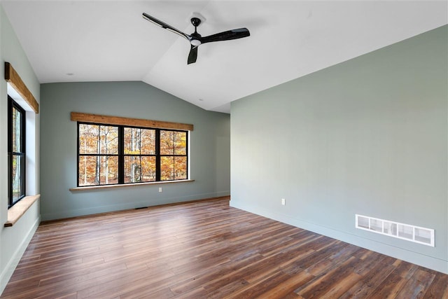 unfurnished room with ceiling fan, lofted ceiling, and hardwood / wood-style flooring