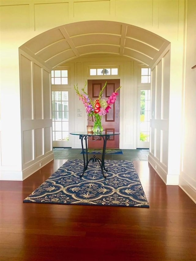 interior space with dark hardwood / wood-style floors and a wealth of natural light