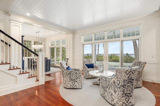 sunroom / solarium featuring plenty of natural light and french doors