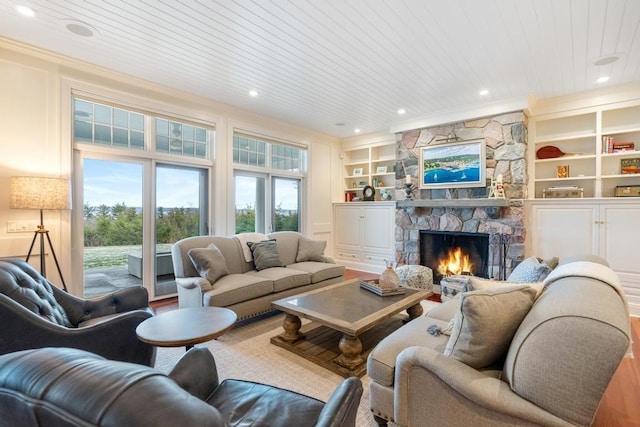 living room featuring a fireplace, built in features, and wooden ceiling