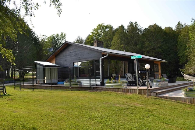 view of property's community featuring a yard and a swimming pool