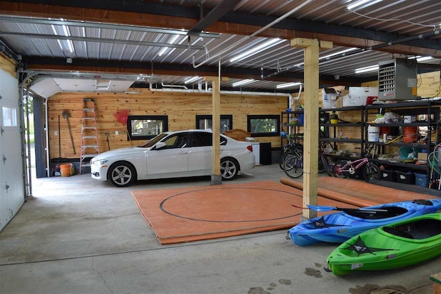 garage featuring wooden walls