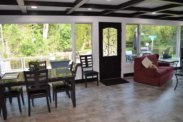 interior space featuring hardwood / wood-style floors, beamed ceiling, and coffered ceiling