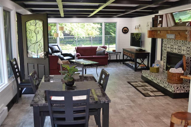 dining space featuring hardwood / wood-style flooring and coffered ceiling