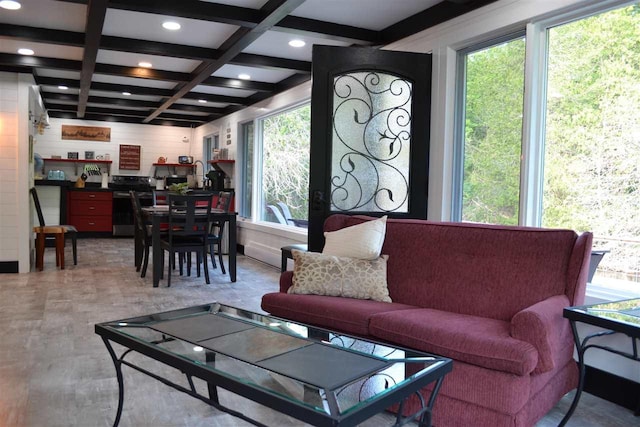 living room with beam ceiling and coffered ceiling