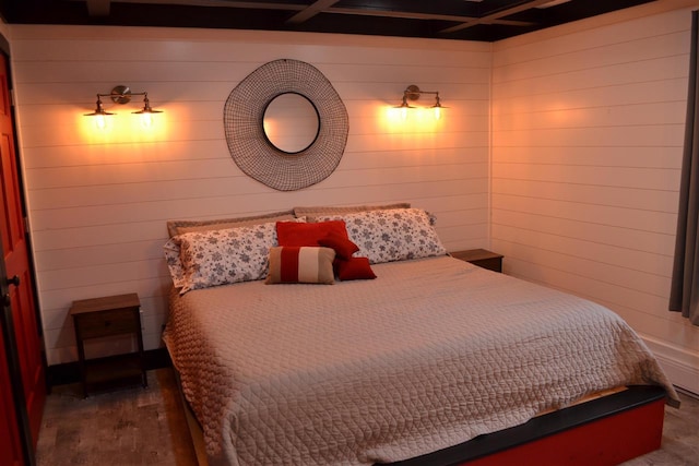 bedroom featuring dark hardwood / wood-style floors and wood walls