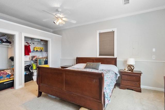 bedroom featuring ornamental molding, light colored carpet, ceiling fan, and visible vents