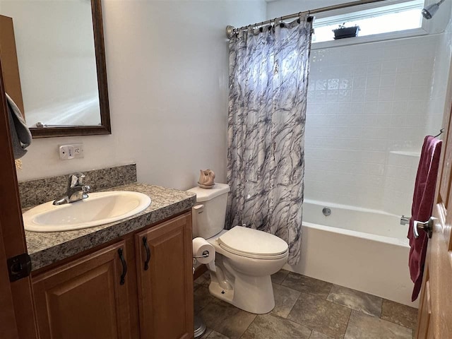 full bathroom with shower / bath combo, vanity, and toilet