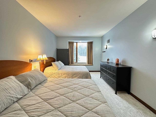 bedroom with light carpet